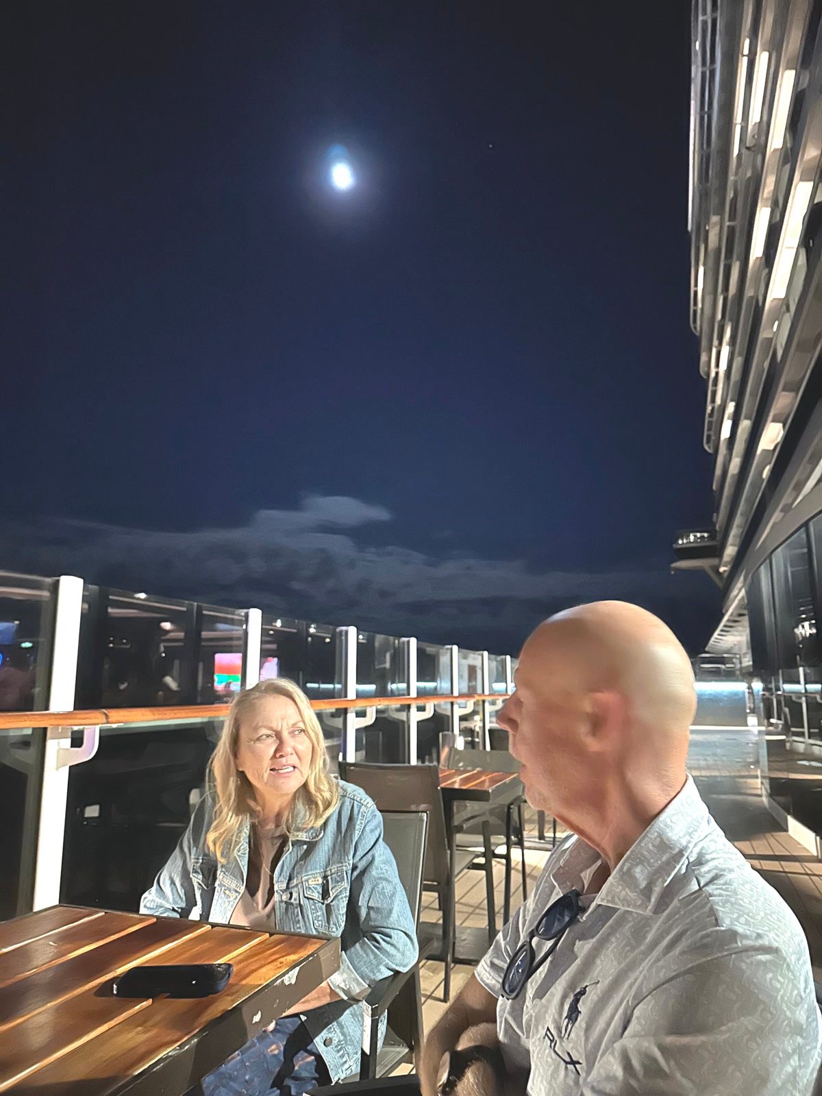 Tim and Lori on the cruise ship deck under the moon