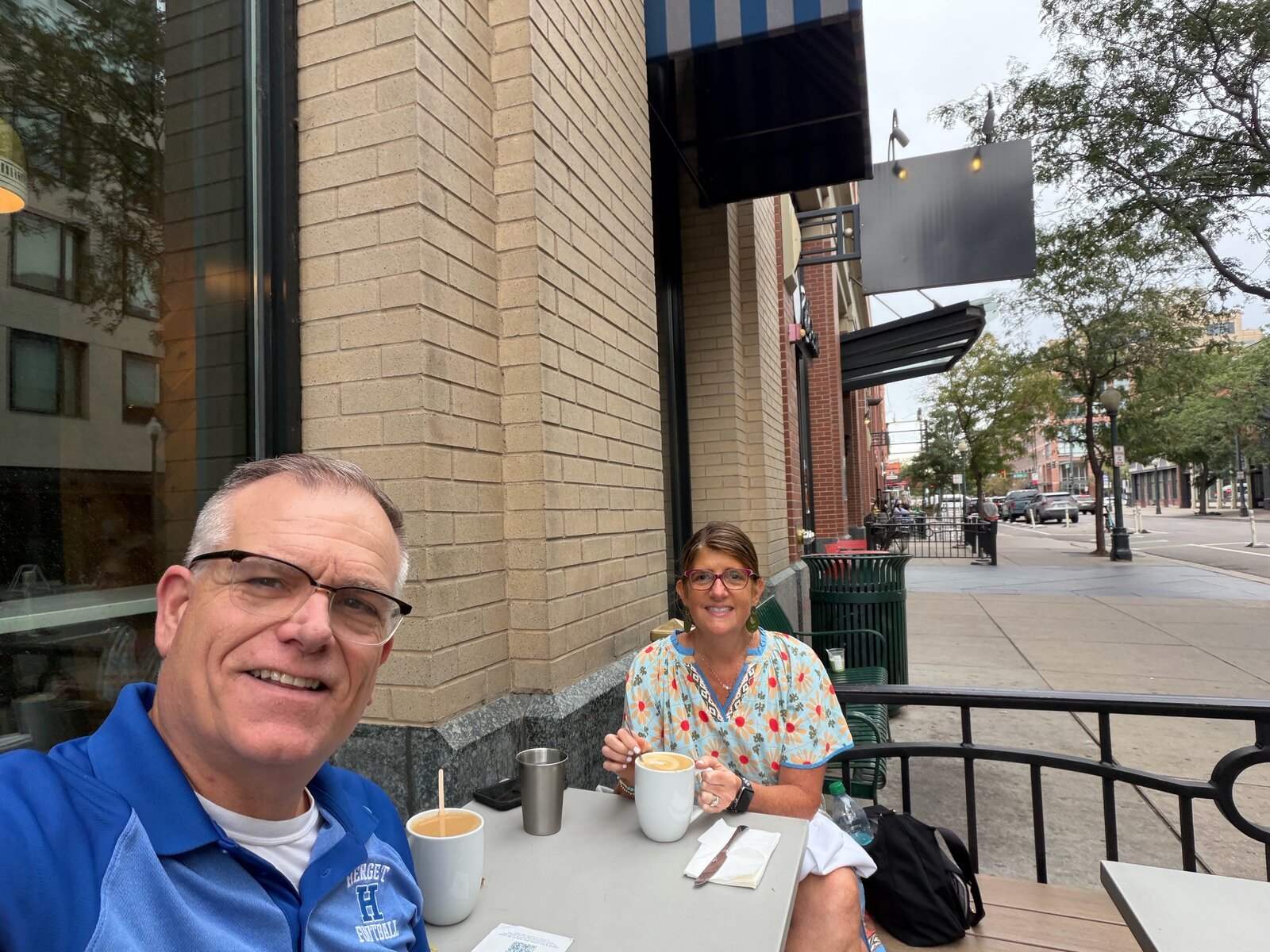 Chuck and companion on a cafe patio in Boulder