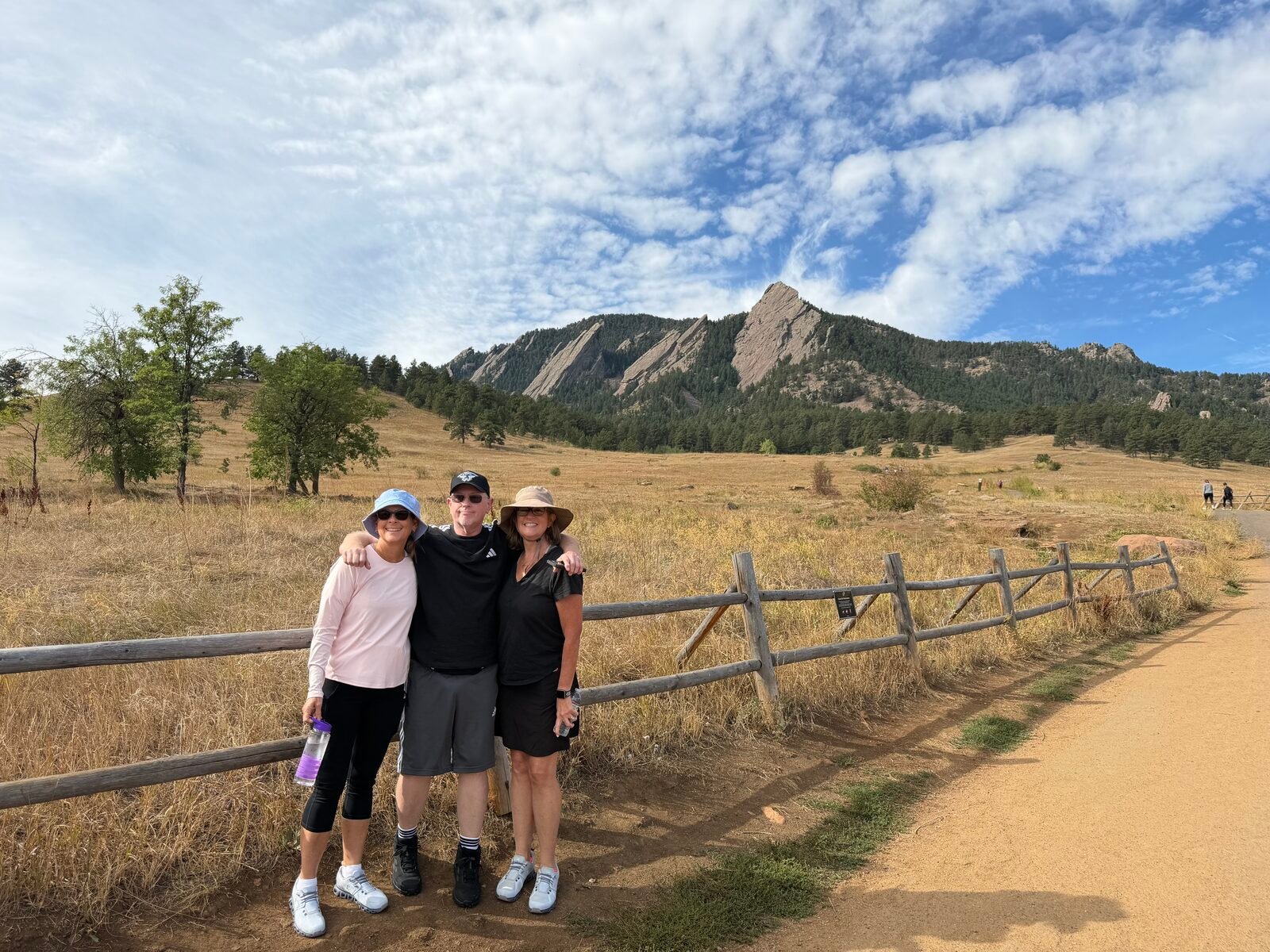 Group of three at Chautauqua with the Flatirons
