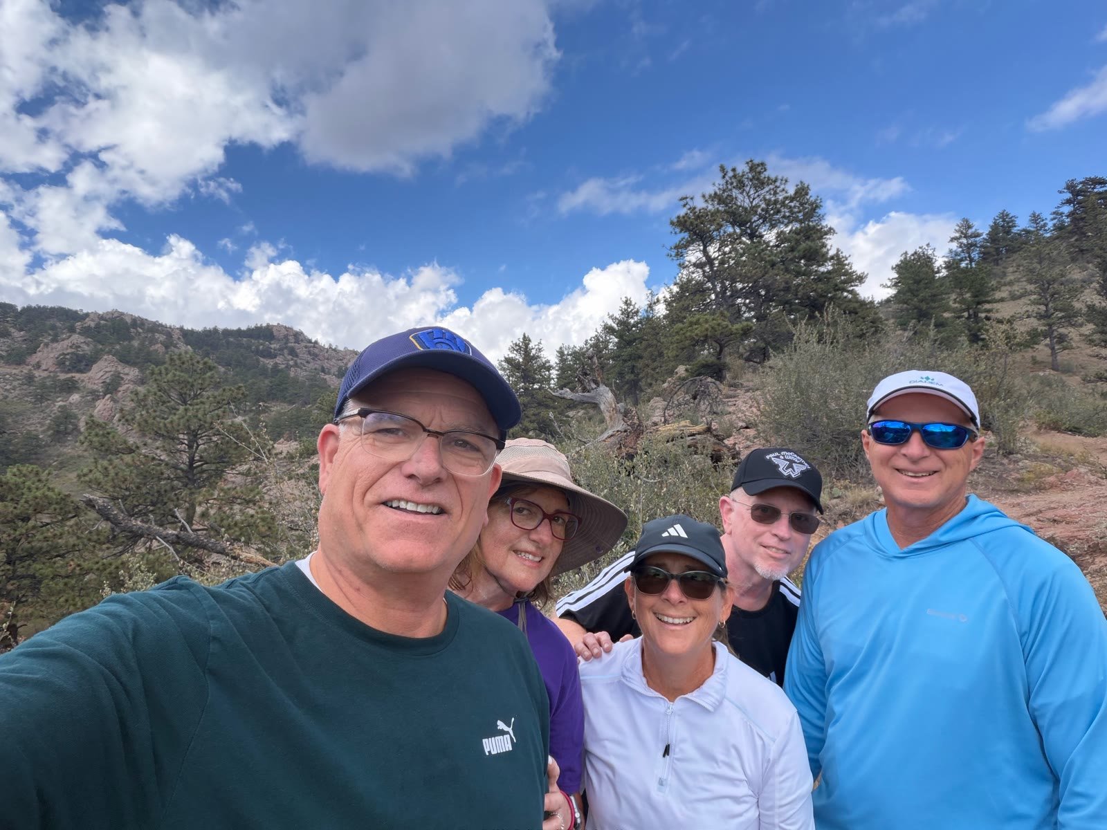 Hiking group selfie on a Boulder-area trail