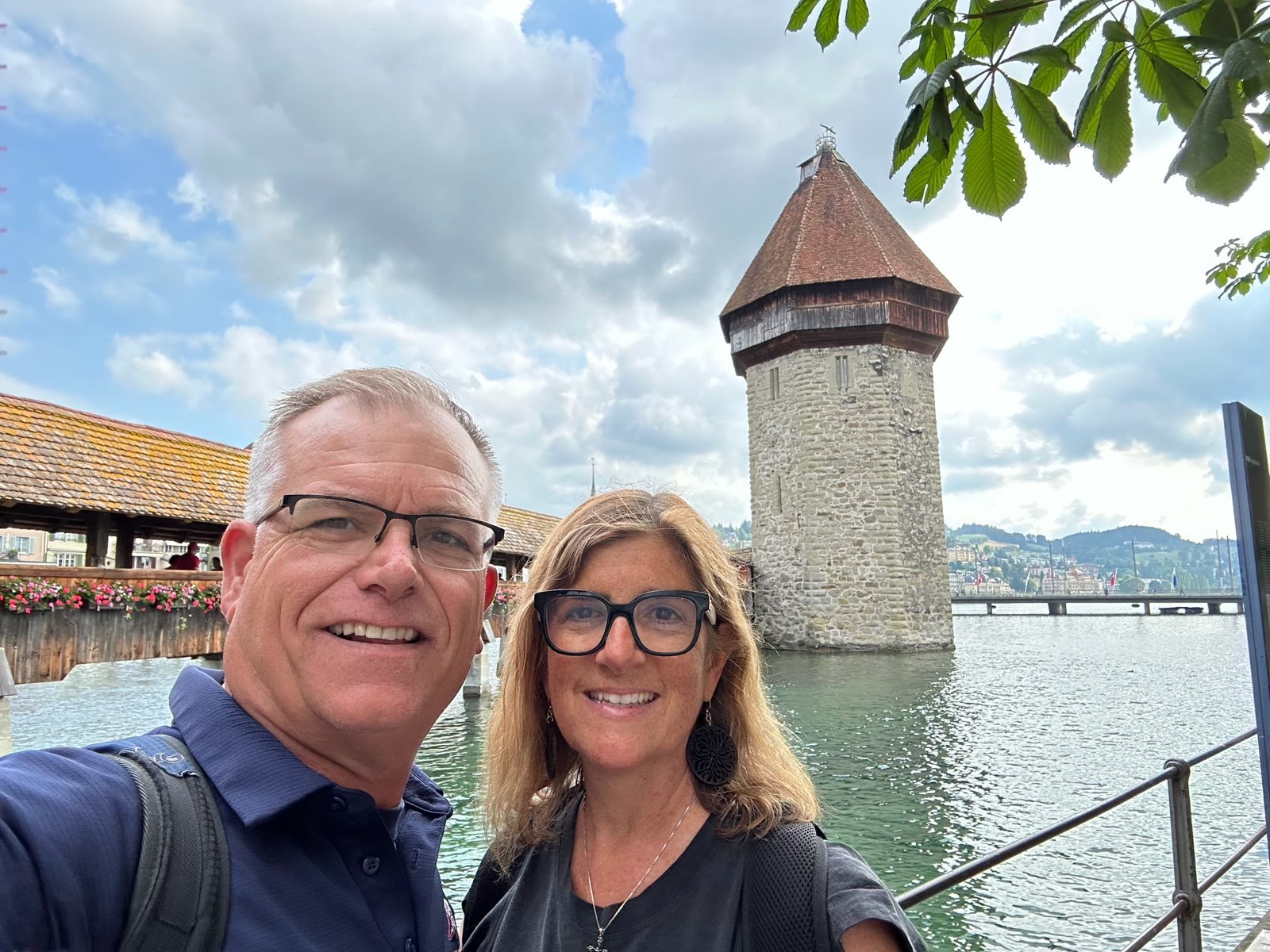 Chuck and Leslie smiling by Chapel Bridge in Lucerne