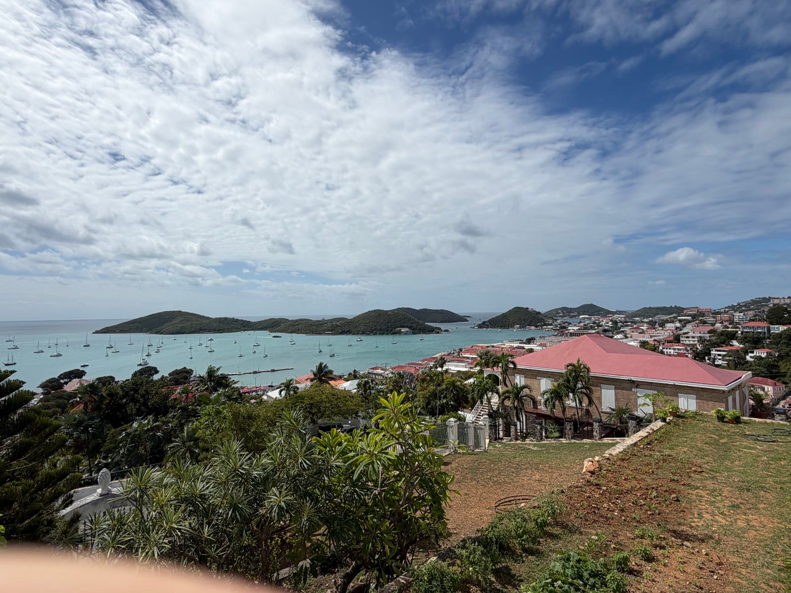 Sailboats anchored in the turquoise harbor in St. Thomas