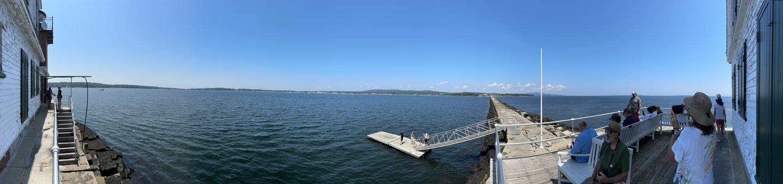 Panoramic view of a Maine breakwater and harbor from a deck