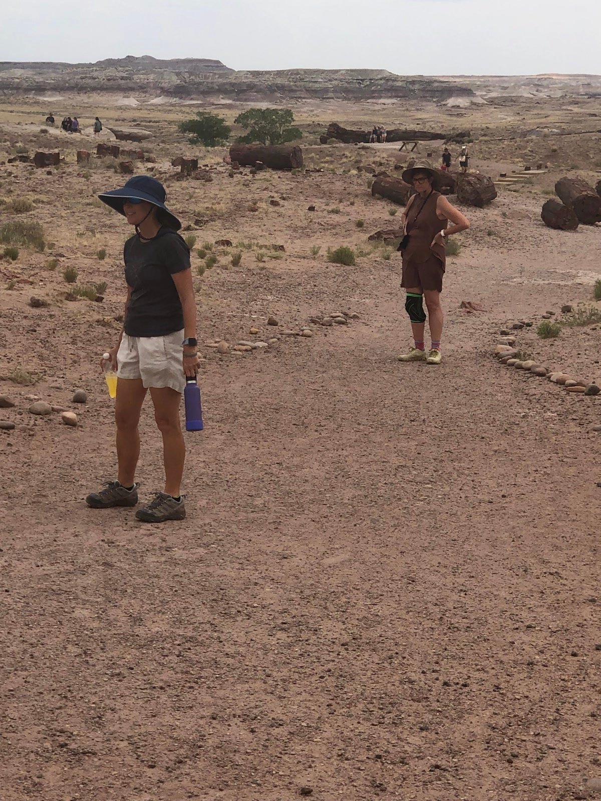 Tracey Bryant and Leslie on a rock-lined trail at Petrified Forest