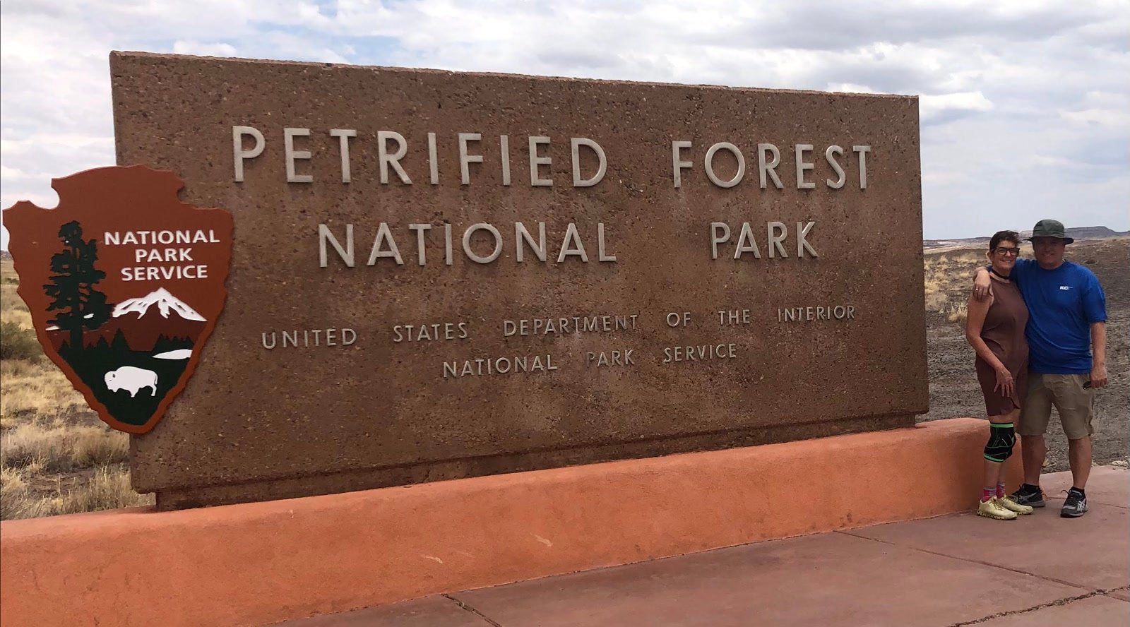 Leslie and Chuck at the Petrified Forest National Park entrance sign
